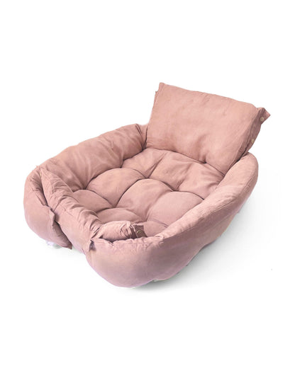 Cama transformable rosa para perro en posición desplegada, vista frontal.